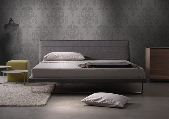 A fully upholstered modern bed frame with steel sled base. Five Elements Furniture