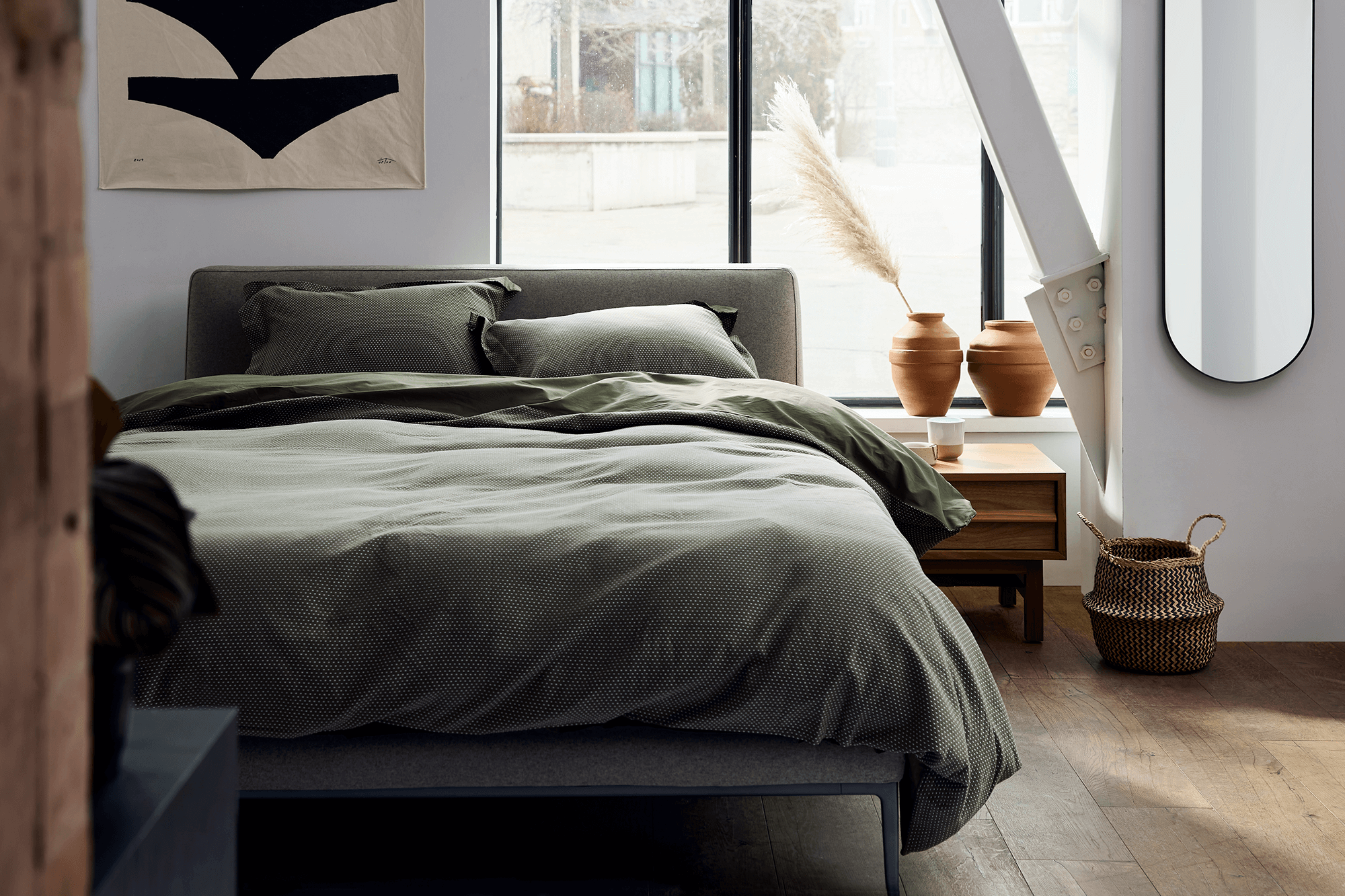 EQ3 Oma upholstered bed with metal base at Five Elements in Austin