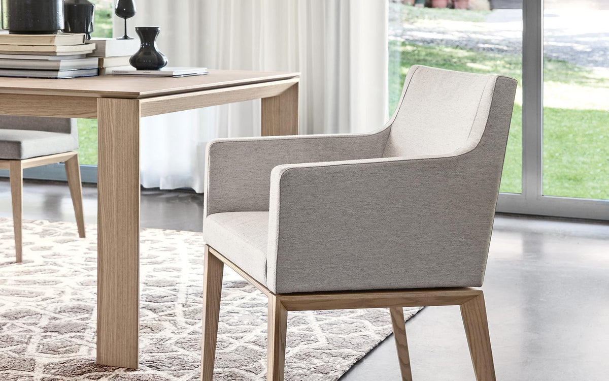 The modern upholstered Bess dining arm chair by Calligaris. Five
